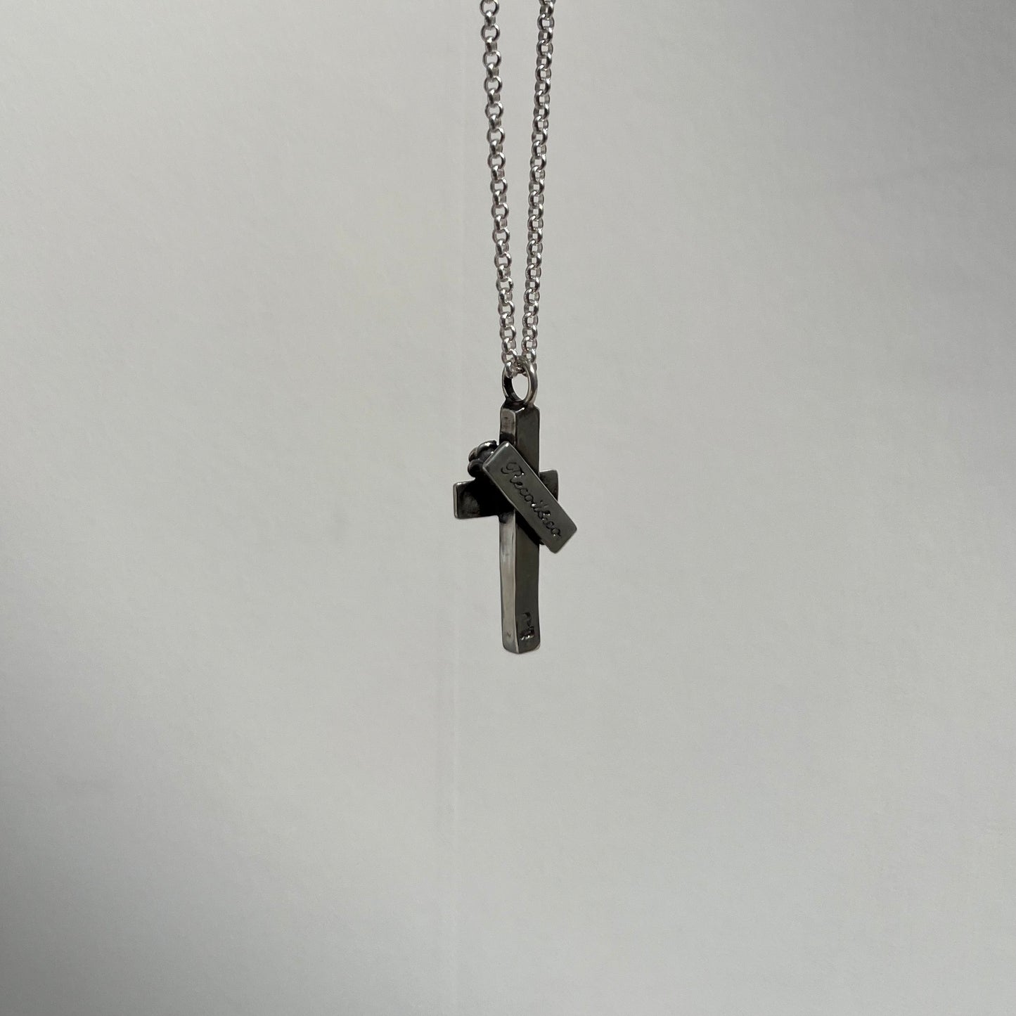 Label Cross with 2 Point Rose Pendant