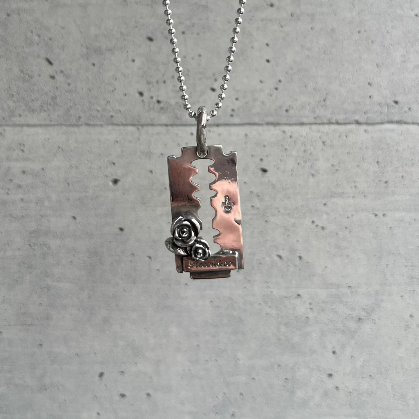 Razor with Rose Pendant